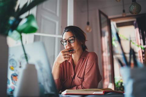 Woman looking at a computer.