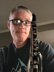 Patterson holding his contra alto clarinet.