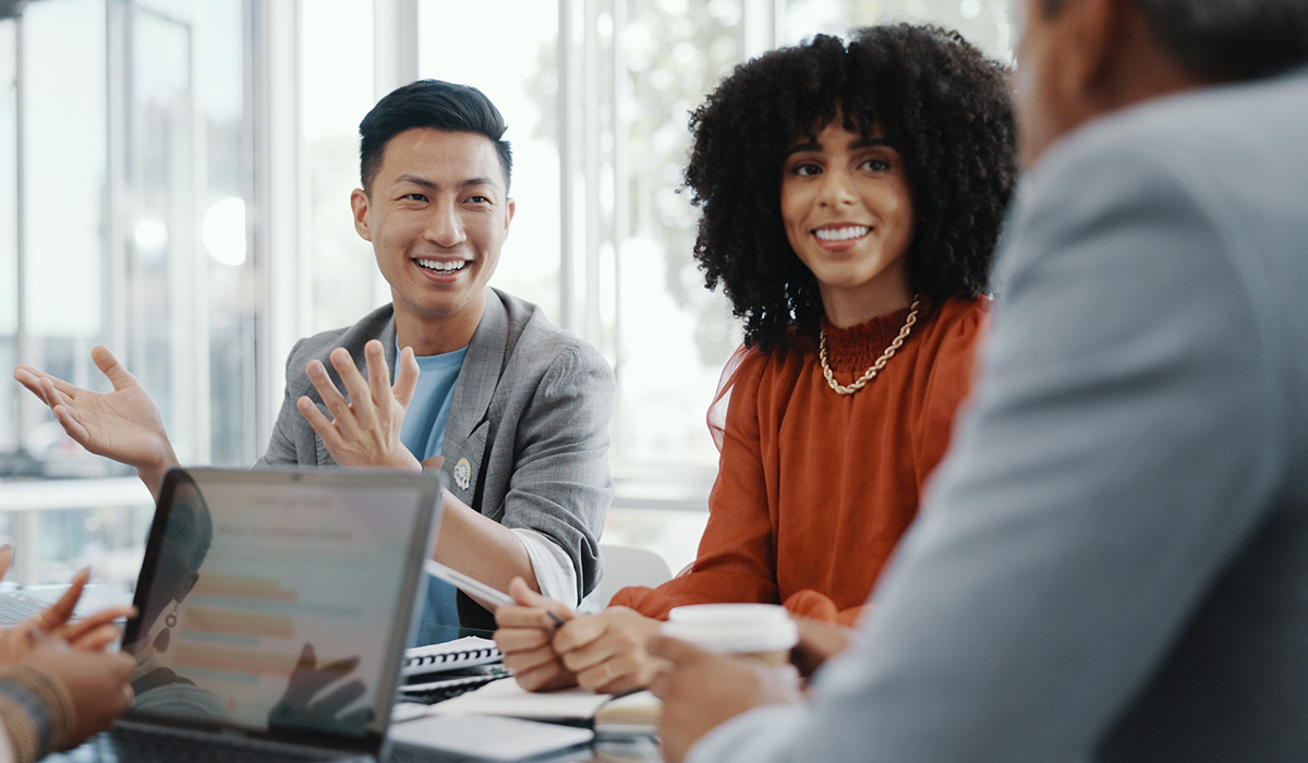 diverse group of business professional around a table