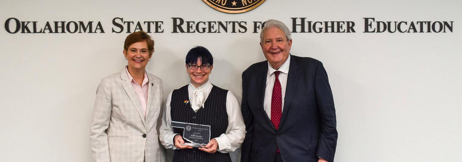 Kara Stanley with award and representatives of the State Regents.