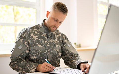 soldier using laptop for course work