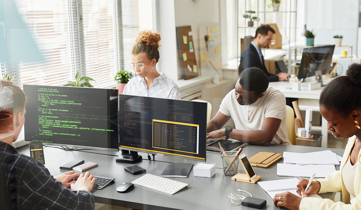 office with several computer science professionals working at their stations