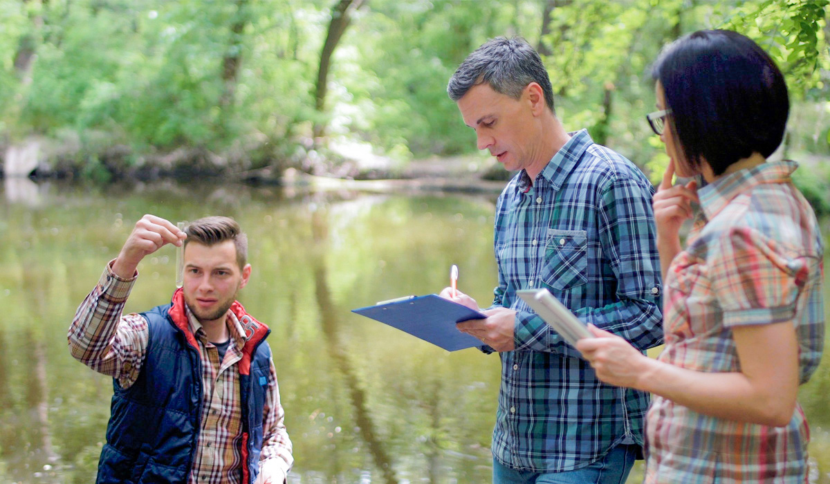 Group of students analyzing water sample