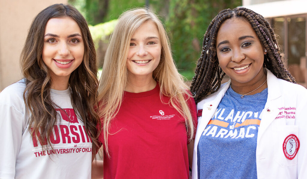 3 smiling students