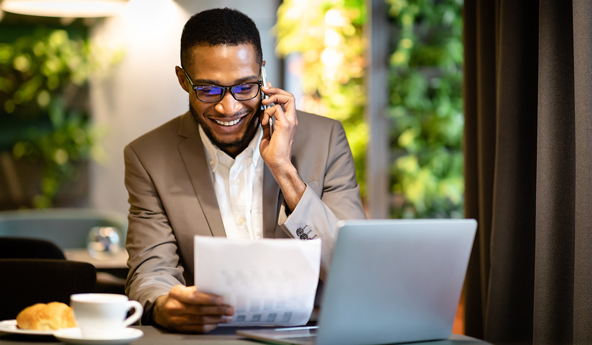 smiling student viewing financial aid packet