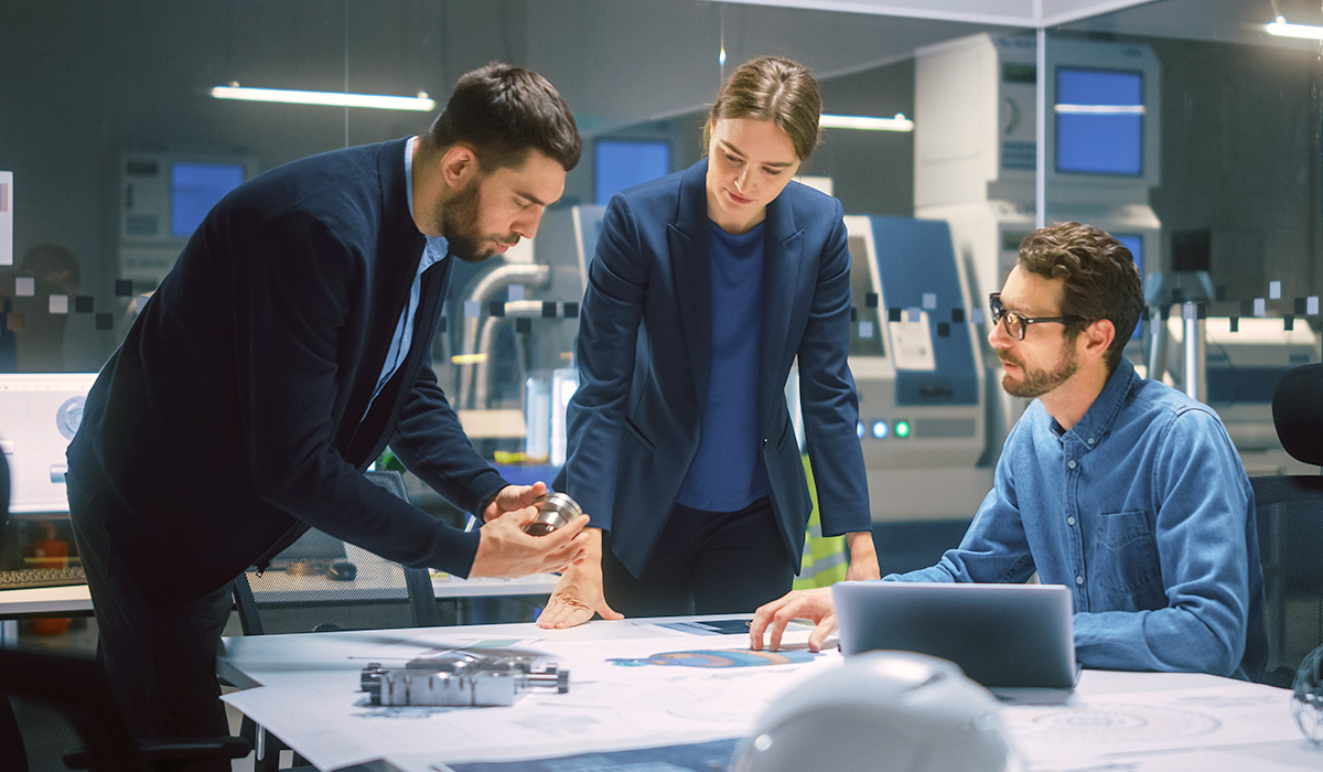 3 engineers discussing a project