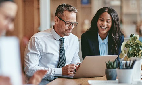 accountants working at conference table