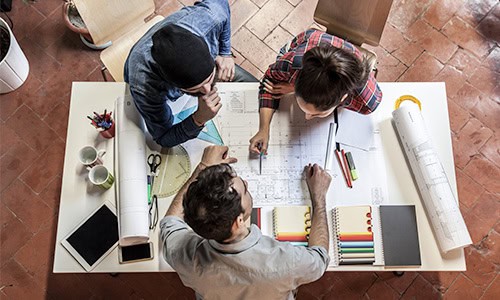 decorative image of two sustainable architecture students working on a project