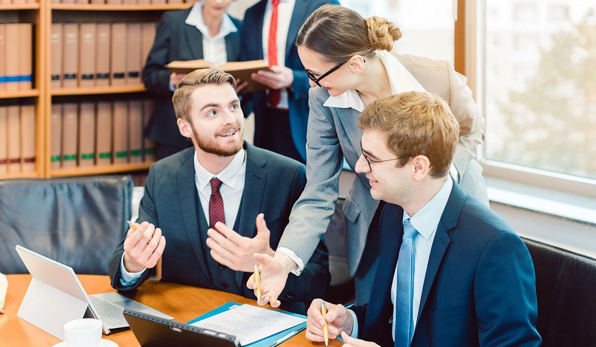 Group of lawyers discussing contracts