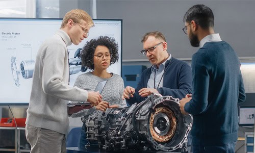 decorative image of 4 industrial engineers discussing a project