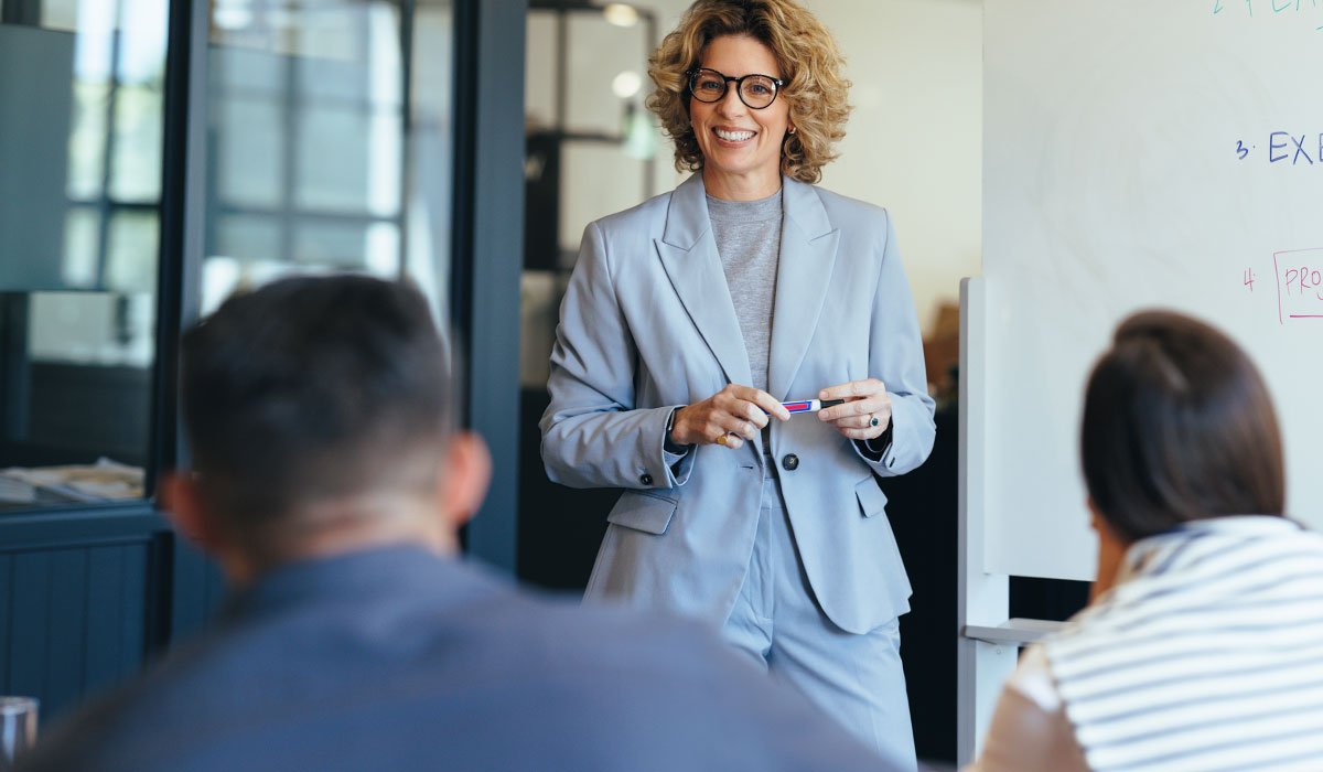 business executive presenting at a meeting