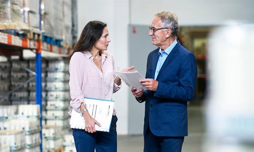 decorative image of supply chain managers checking inventory