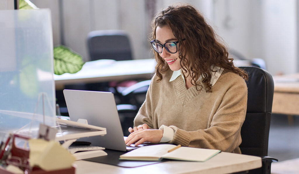 student working on her laptop