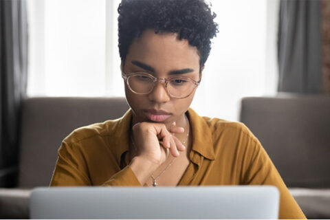 Adult student looking at a computer