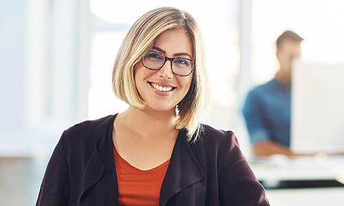 Smiling counselor sitting at her desk