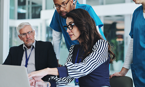 Health Administration professional reviewing reports