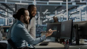 engineering professions reviewing a project on a computer