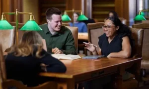 Three law students studying in the College of Law Library