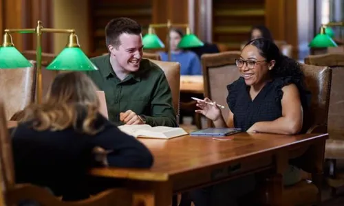 Three law students studying in the College of Law Library